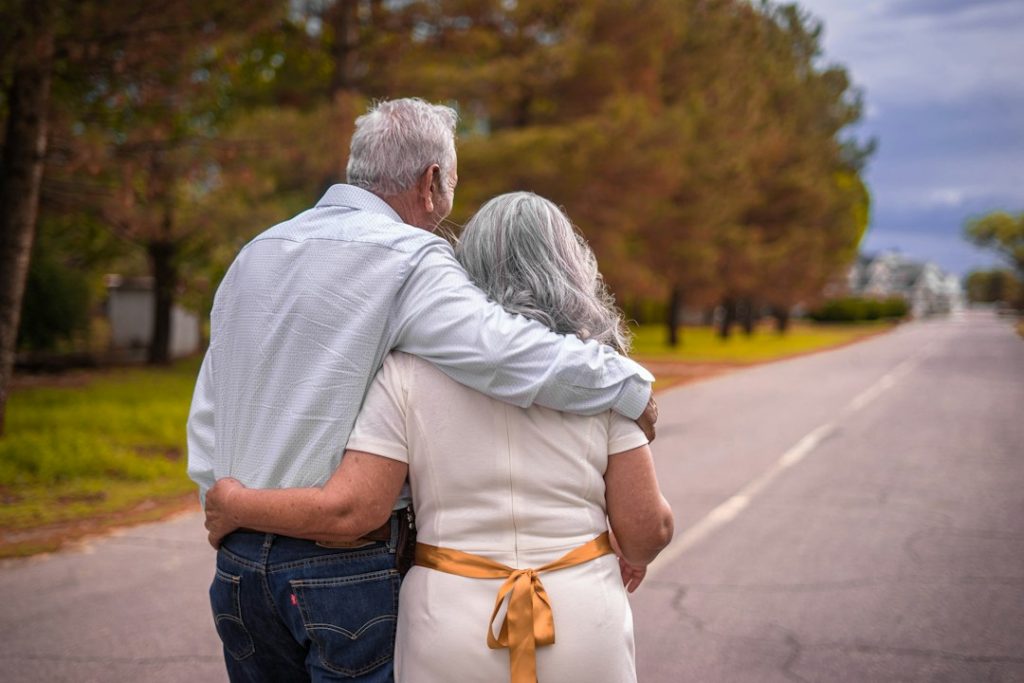 Older couple walking outdoors